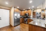 The spacious kitchen has granite countertops